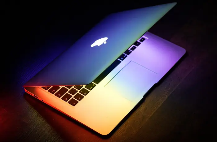 Laptop lit in rainbow colours